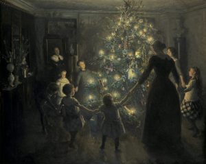 Família a dançar em volta de árvore de natal